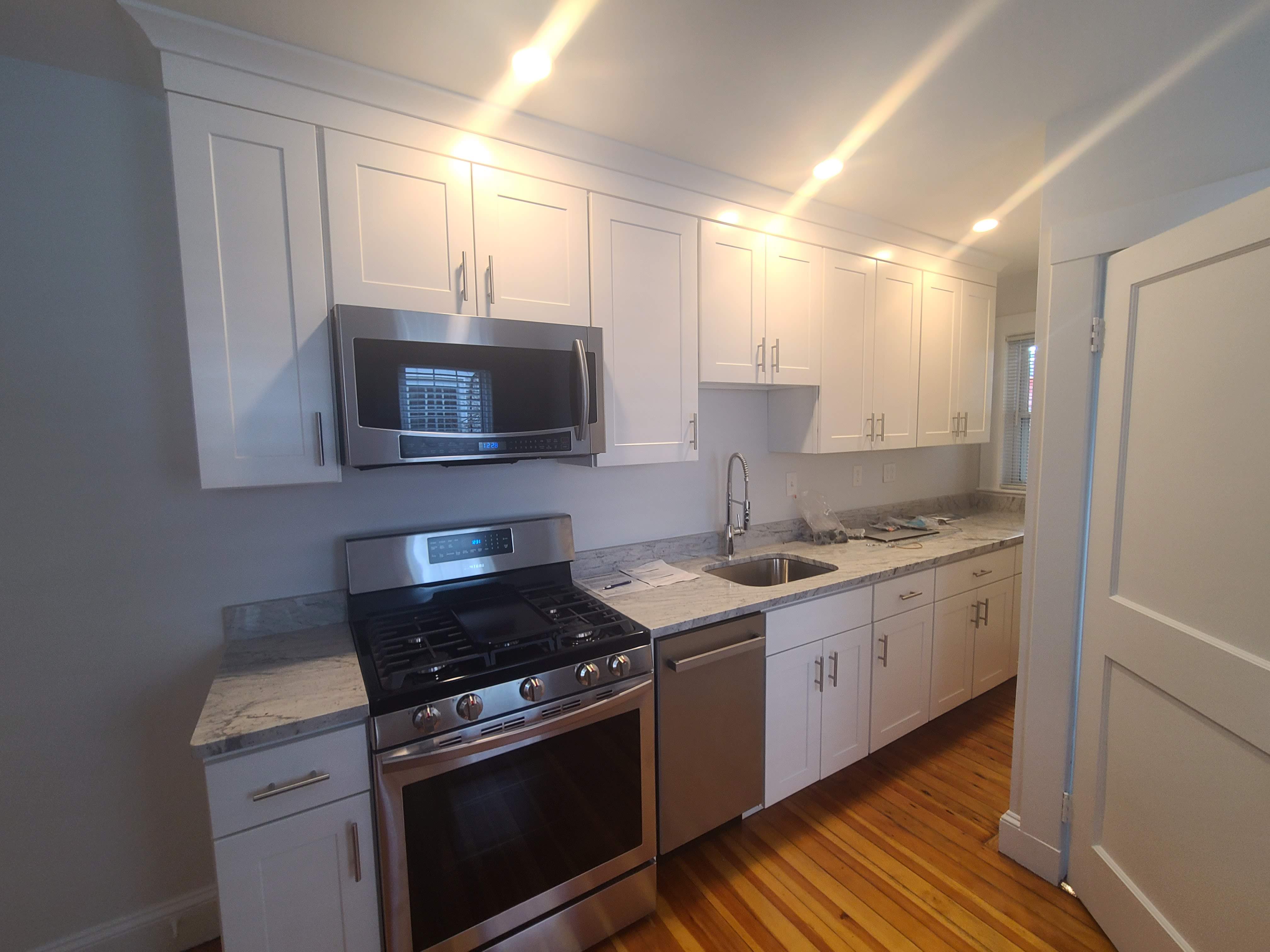 Quartz countertops and tile backsplash Greater Boston